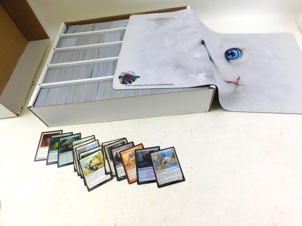 Box of Roughly 5000 Magic The Gathering Game Cards and: Box of Roughly 5000 Magic The Gathering Game Cards and a She White Dragon Cat Game Mat. MTG First spread of cards is what the consignor wanted to point out as in the box. The last spread is a random g