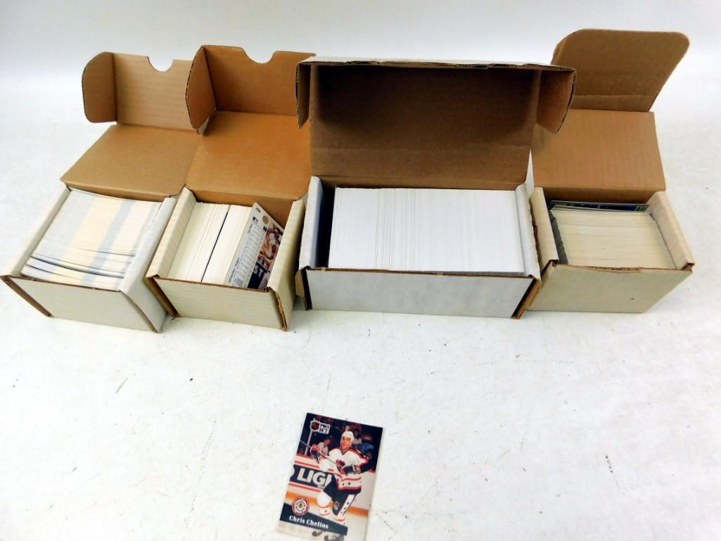 4 boxes of sports cards Each box appears to be at least (1 of 6)