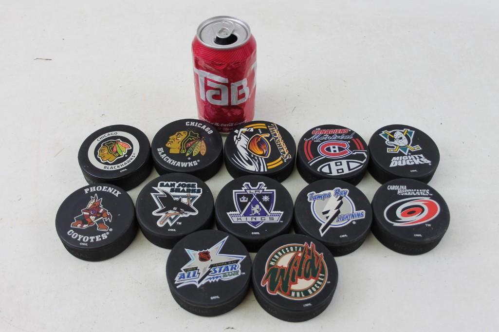 Lot of 12 NHL Hockey Pucks - Different teams: Lot of 12 NHL Hockey Pucks - Different teams