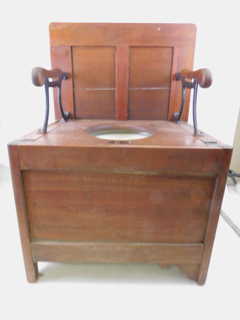 Antique Commode / toilet: Antique Commode. Roughly 21" x 18" x 18" when closed or 21" x 18" x 31" when opened. The locking mechanism works to keep it open. Looks like it would work, but we did not test