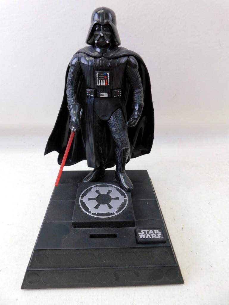 Electronic Darth Vader Bank: Electronic Darth Vader Star Wars Bank. It works. It makes all sorts of noise and movements when you put a coin in or push the button