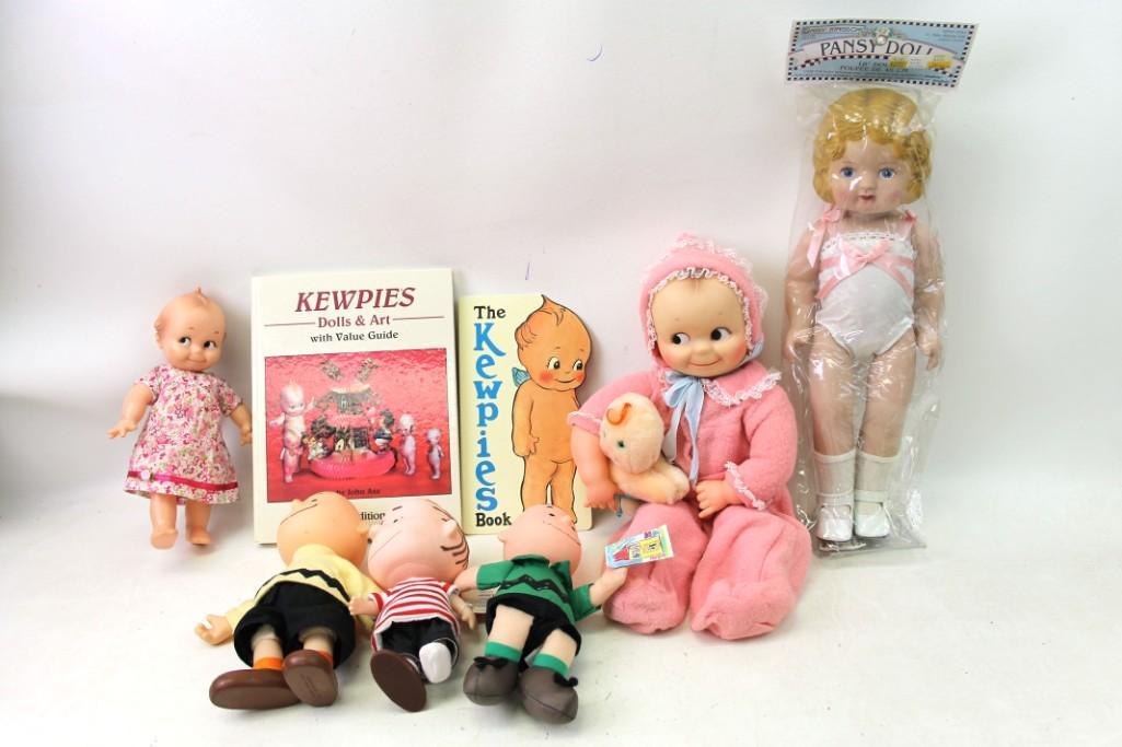 2 Cameo Kewpie Vinyl Dolls , 2 Kewpie Books, Daisy: 2 Cameo Kewpie Vinyl Dolls , 2 Kewpie Books, Daisy Kingdom Vinyl Doll NIP , 3 Peanuts Linus & Charlie Brown Dolls , Hugga Bunch Giggles . Linus is missing a shoe and some pages in the book are sta