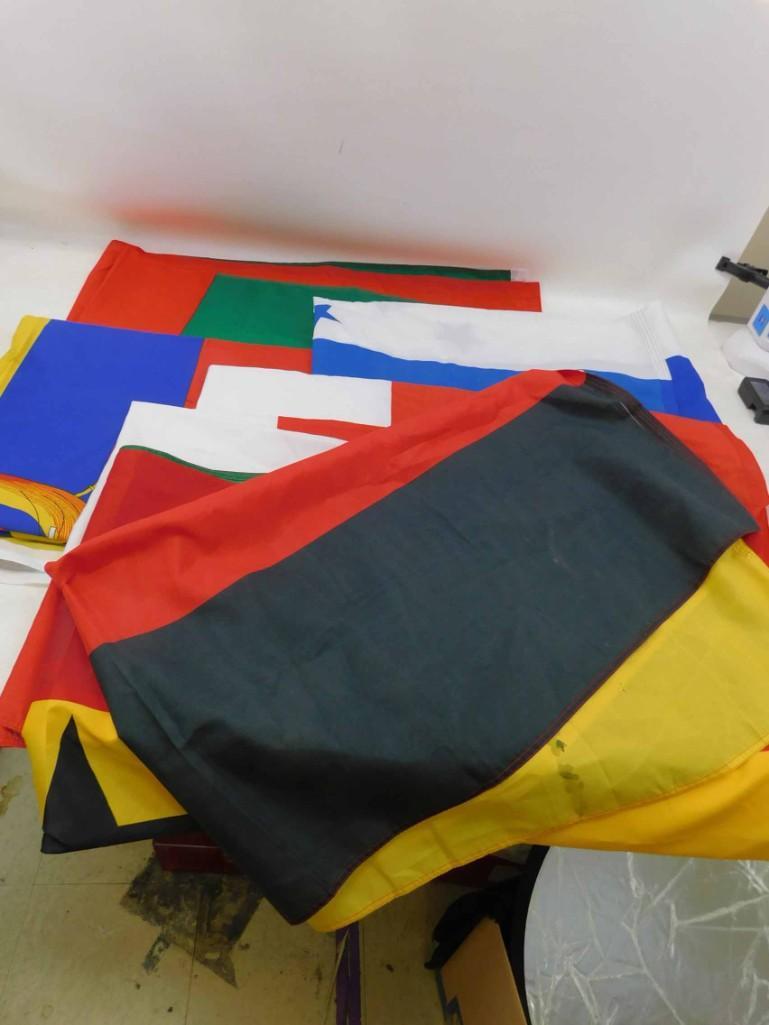 Lot of 7 International Flags incl French , Swiss ,: Lot of 7 International Flags incl French , Swiss , German , etc . Measures about 36"x61" Condition: some of the flags have stains