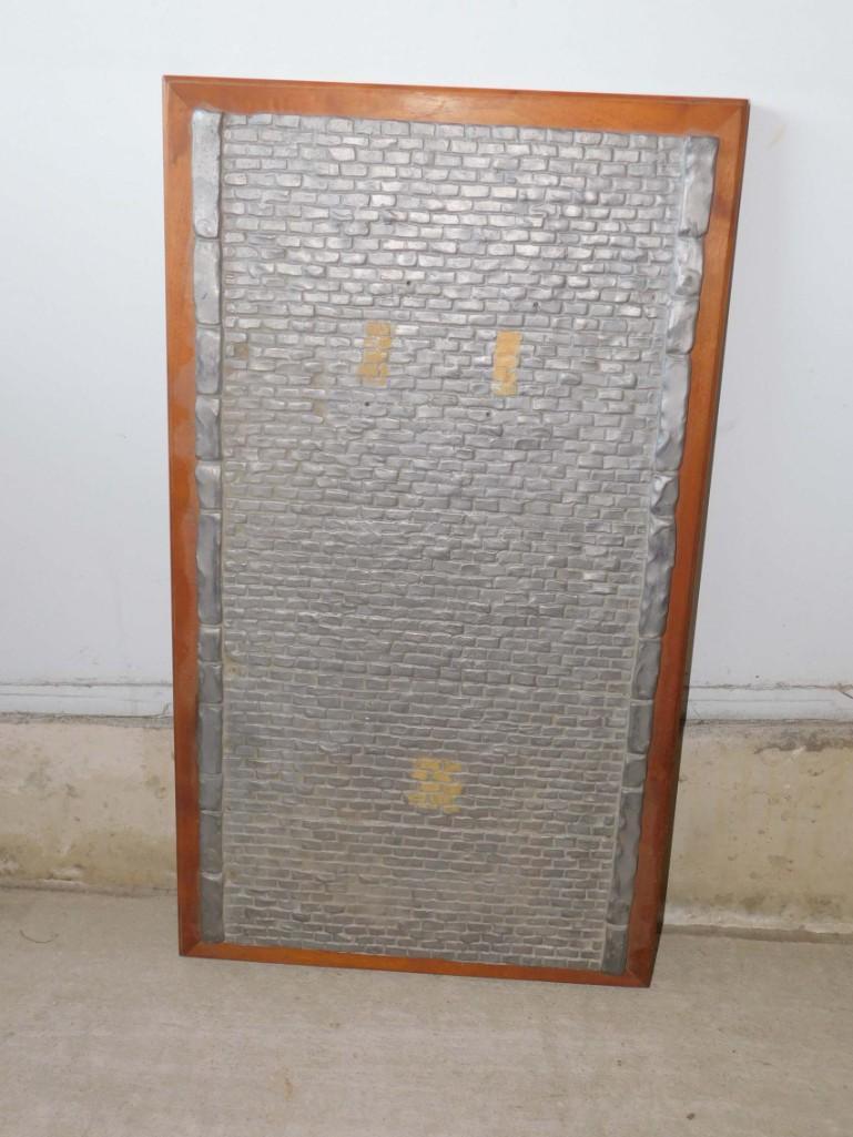 Lead Brick Wall Art: Lead Brick Wall Art , has some tape residue on it. Measures about 17.5"x31" , Very heavy (it's actually made of lead) ALL ITEMS MUST BE PICKED UP EITHER ON SATURDAY, JULY 17TH DURING OR WI