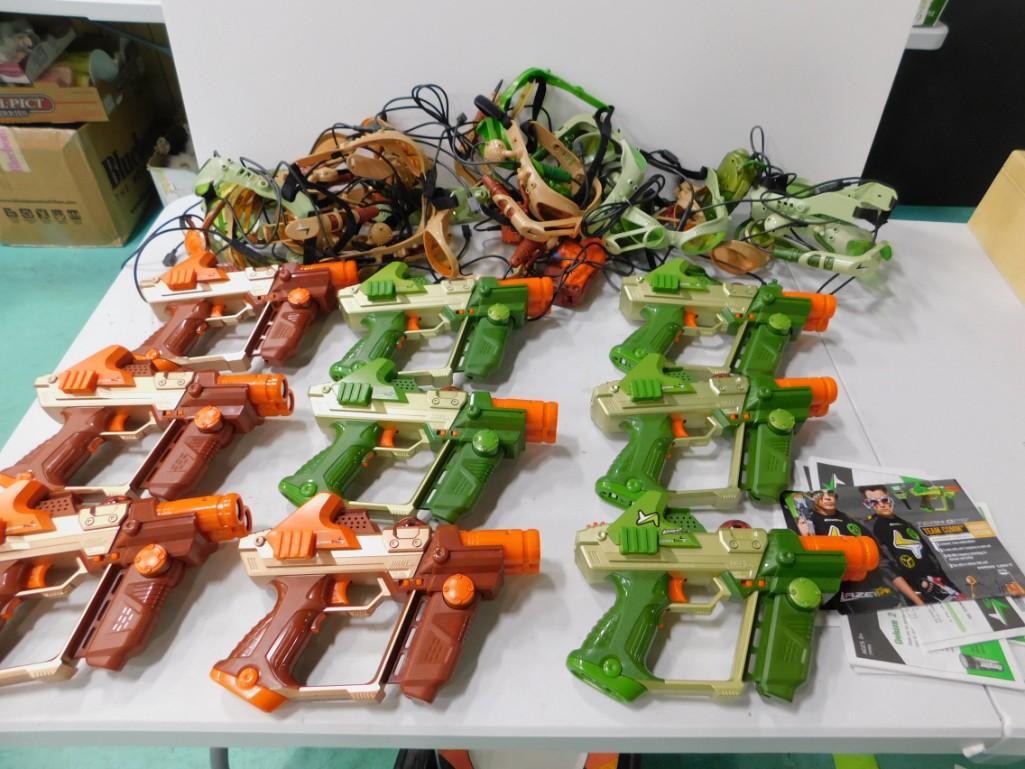 9 Lazer Tag Guns , Booklet, and Headsets , etc: 9 Lazer Tag Guns , Booklet, and Headsets , etc Condition: untested