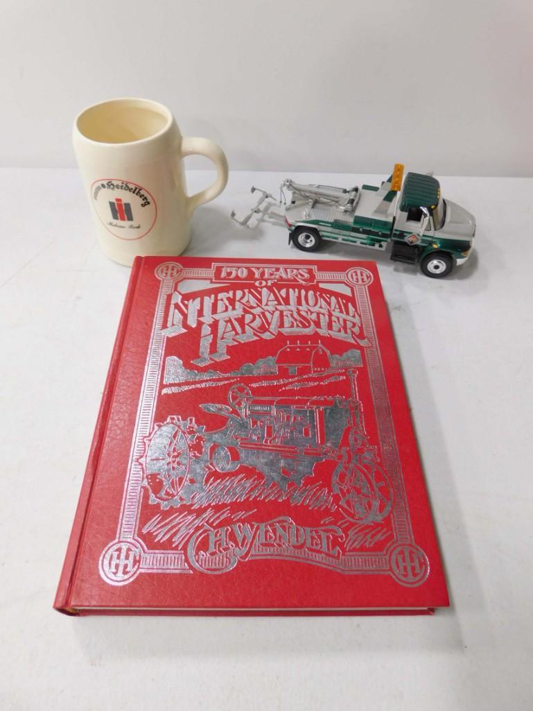 International Harvester Lot incl 150 Years of: International Harvester Lot incl 150 Years of International Harvester Book , Heidelberg Beer Mug , International Harvester Die Cast Tow Truck 1:32 Scale