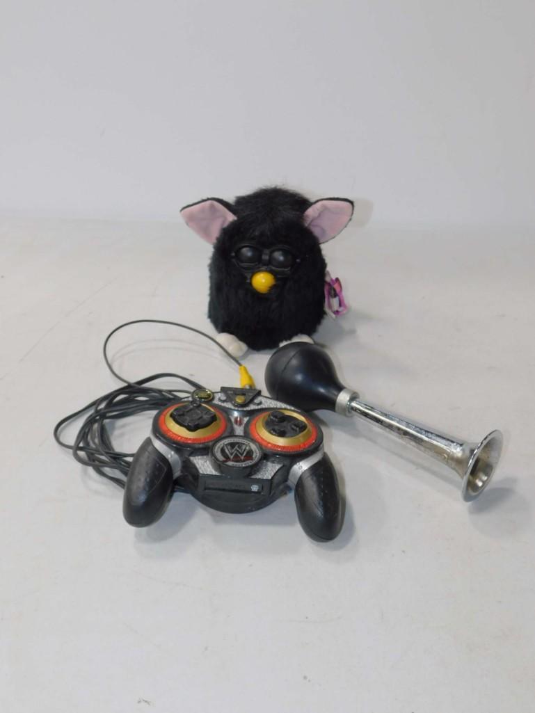 Toy Lot incl Furby , Wrestling Entertainment Control ,: Toy Lot incl Furby , Wrestling Entertainment Control , Bike Horn Condition: untested