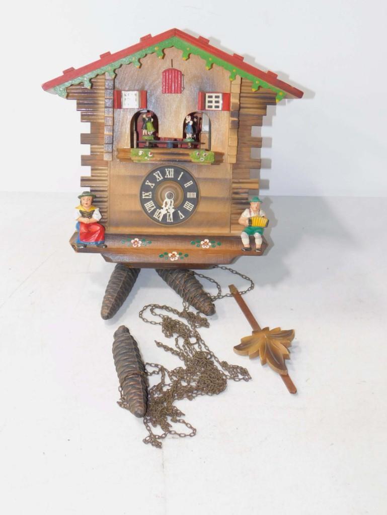Vintage Blaue Donau Cuckoo Clock: Vintage Blaue Donau Cuckoo Clock. The clock mechanism and the dancers seem to work, but the bellows mechanism may be stuck. It probably needs oiling and we can't guarantee the accuracy.