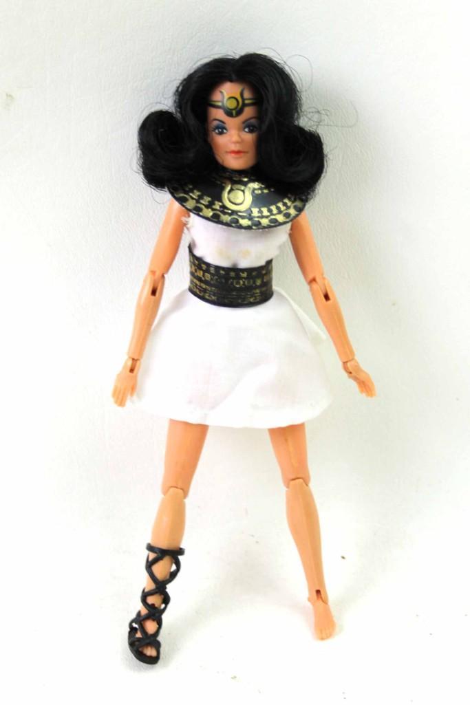 Vintage 1976 Mego Isis 8" Female Action Figure or Doll: Vintage 1976 Mego Isis 8" Female Action Figure or Doll wearing original dress with belt . Condition: Has only ONE sandal/shoe, underwear. Dress has some small stains. Clean with tight joints