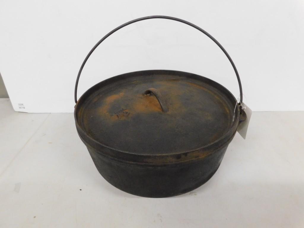 Cast Iron #12 Dutch Oven: Cast Iron #12 Dutch Oven Condition: has the name "Haynes" rusted on it.