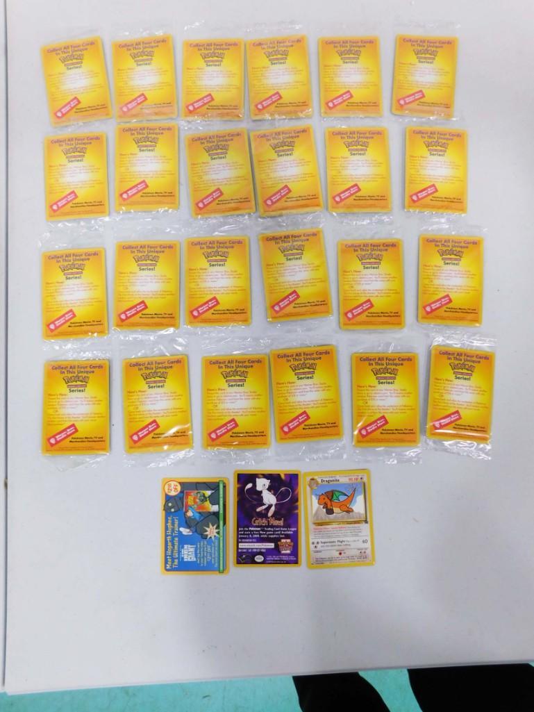 Lot of 26 Pokemon Trading Card Movie Game Series Cards: Lot of 26 Pokemon Trading Card Movie Game Series Cards . These are cards that you would get at the movie and then trade it in at a Warner Bros store, except these were never traded in. There are 25 th