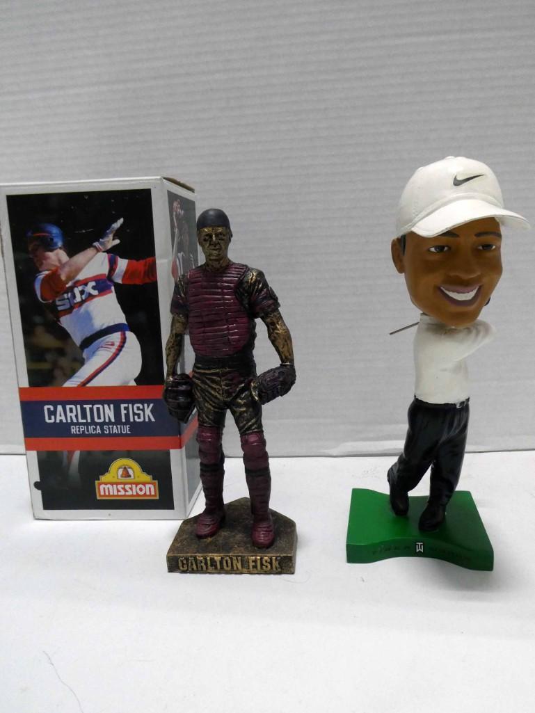 Carlton Fisk Statue and Tiger Woods Bobblehead: Carlton Fisk Statue and Tiger Woods Bobblehead Condition: Tiger Woods is missing the head from his golf club