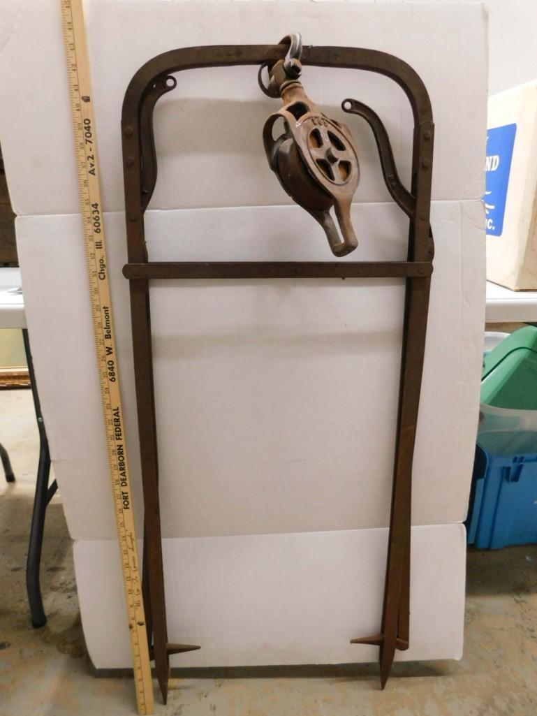 Vintage Industrial Pulley: Vintage Industrial Pulley on a stand. Rusty with wood center