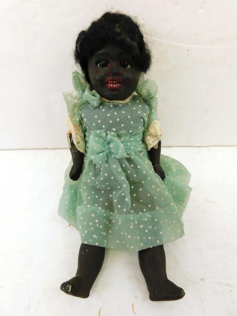 1890s Kahn 10" African American/Black Character Paper Mache TLC Doll: 1890s Kahn 10" African American/Black Character Paper Mache TLC Doll . 10", Paper mache head, arms, and legs. Cloth body split open at waist. Stationary glass eyes, repaired left arm. Some damage to l