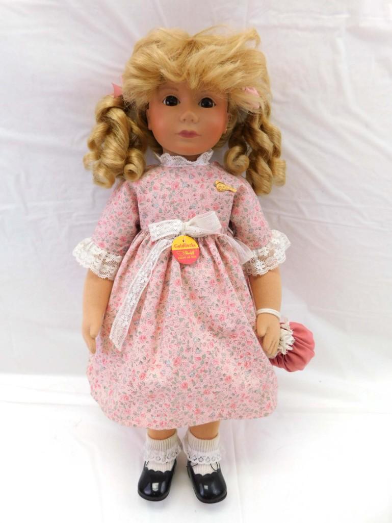 1993 Steiff 19" Goldilocks Doll: 1993 Steiff 19" Goldilocks Doll . 19", Vinyl head, jointed cloth body, blond wig. Steiff button in ear. Metal bear pin and paper tag on dress. Orig outfit, clean.