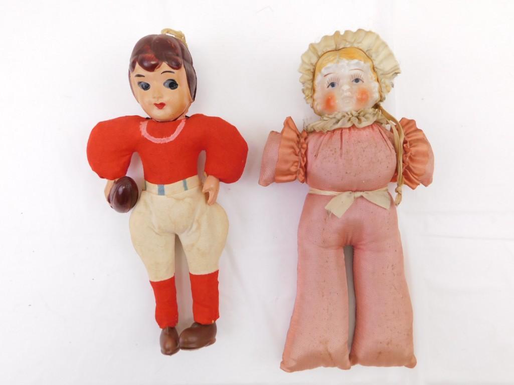 8.5" Porcelain head Satin Body Pin Cushion & Celluloid Football Player Japan Doll: 8.5" Porcelain head Satin Body Pin Cushion & Celluloid Football Player Japan Doll . Pin Cushion doll satin body has old pin holes from use. Celluloid football player clothes have stains/seam open 