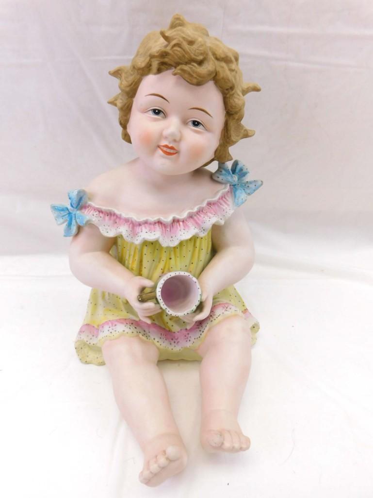 Vtg. 12" Piano Baby Sitting Girl Holding Cup 6111X by Andrea: Vintage. 12" Piano Baby Sitting Girl Holding Cup 6111X by Andrea . 12", ceramic/porcelain, marked, "6111X By Andrea" on bottom