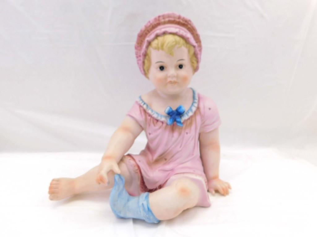 Vtg. 12" Piano Baby Sitting Pink Bonnet Girl Figure: Vintage. 12" Piano Baby Sitting Pink Bonnet Girl Figure . 12", ceramic/porcelain. Sitting girl w/one blue sock, no markings