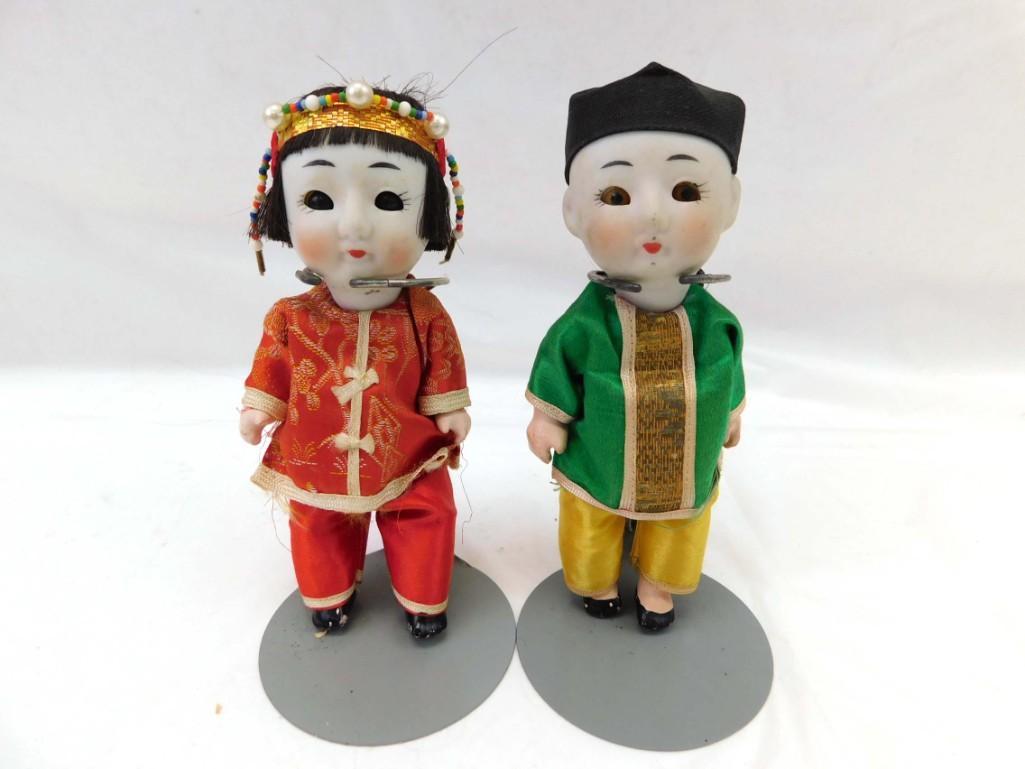 2 6" Asian/Chinese Bisque & Paper Mache Jointed Dolls: 2 6" Asian/Chinese Bisque & Paper Mache Jointed Dolls . 6", bisque heads, sleep glass eyes, paper mache bodies, loose limbs. Wearing ethnic fashions. Marked Japan. Circa 1920s