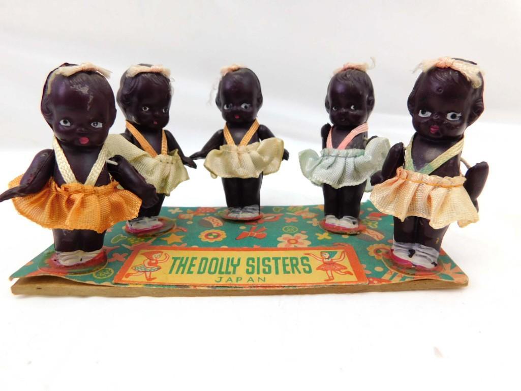 5 The Dolly Sisters 2" African American/Black Celluloid Toddler Dolls, Japan: 5 The Dolly Sisters 2" African American/Black Celluloid Toddler Dolls, Japan . 2", celluloid, movable arms, satin skirts. Dolls marked Japan. On "The Dolly Sisters, Japan" paper.cardboard. Circa 1930s