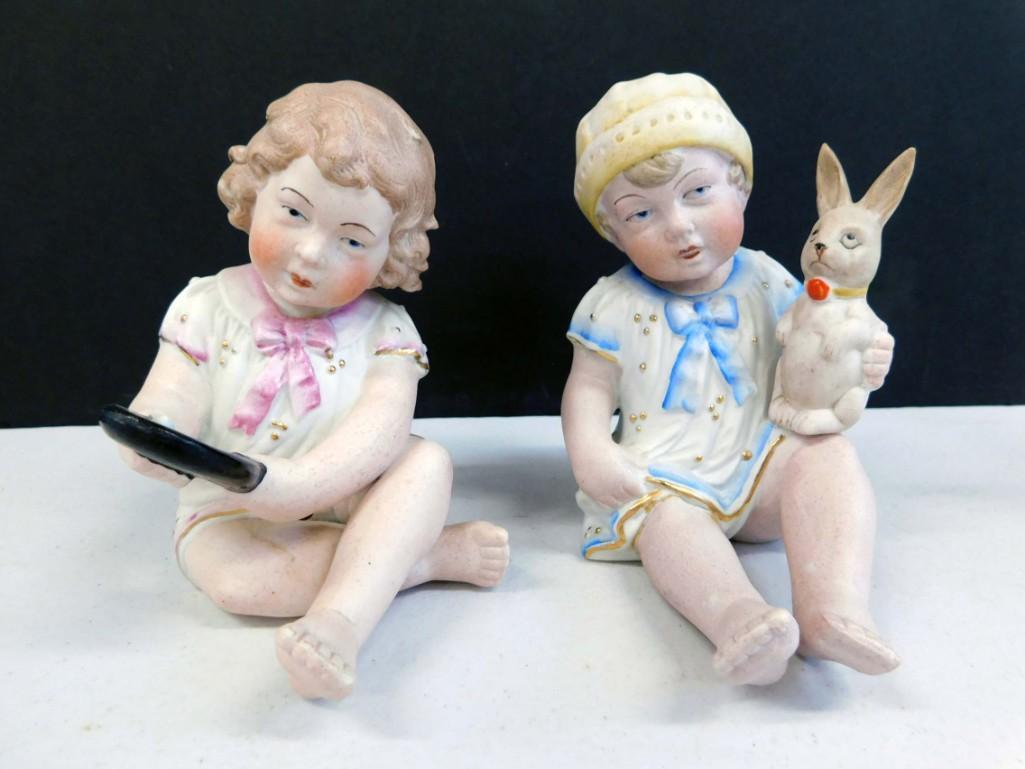 2 German Porcelain Piano Babies: 2 Porcelain Piano Babies . Both are stamped Germany on the bottom