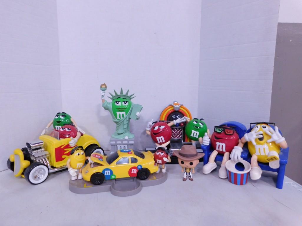 Lot of M&Ms Collectibles: Lot of M&Ms Collectibles including car with red and green, car with red and yellow, jukebox with red and green, movie seats with red and yellow , and green statue of liberty