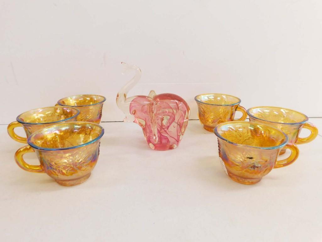 Pink Swirl Art Glass Elephant and 6 Amber Carnival Glass cups: Pink Swirl Art Glass Elephant Paperweight and 6 Amber Indiana Glass Harvest Grape Pattern Carnival Glass cups . 1 cup has a weird lip. Please see pictures