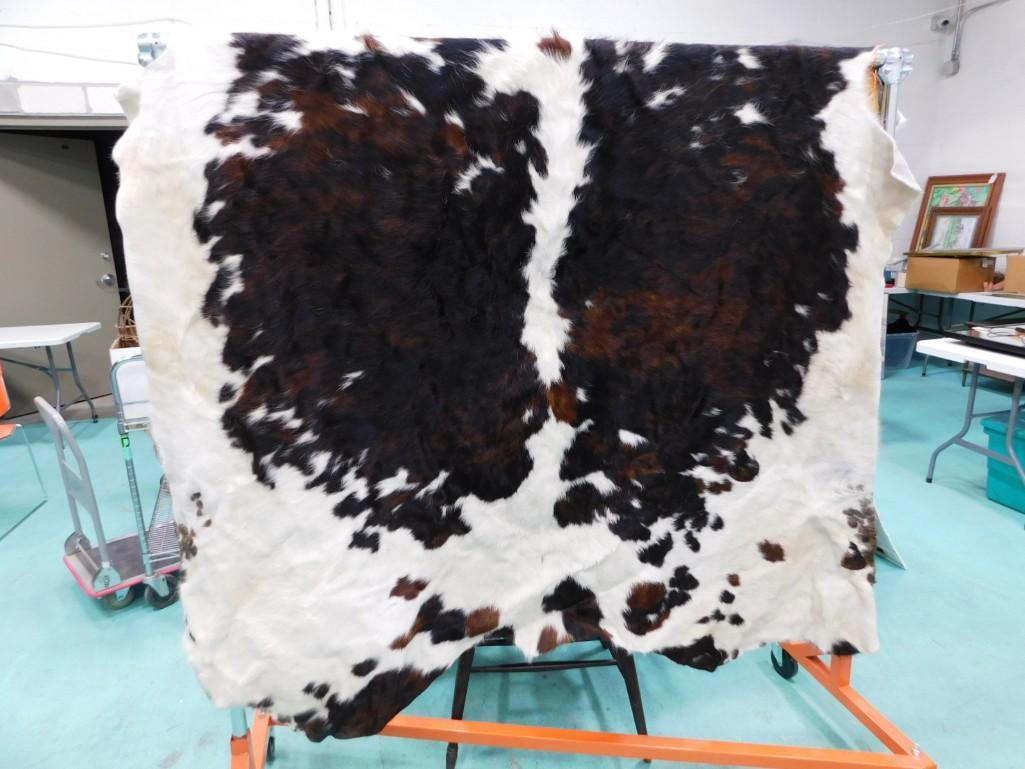 Cow Hide , Brown and White: Cow Hide , Dark Brown and White . Measures about 82"x63"