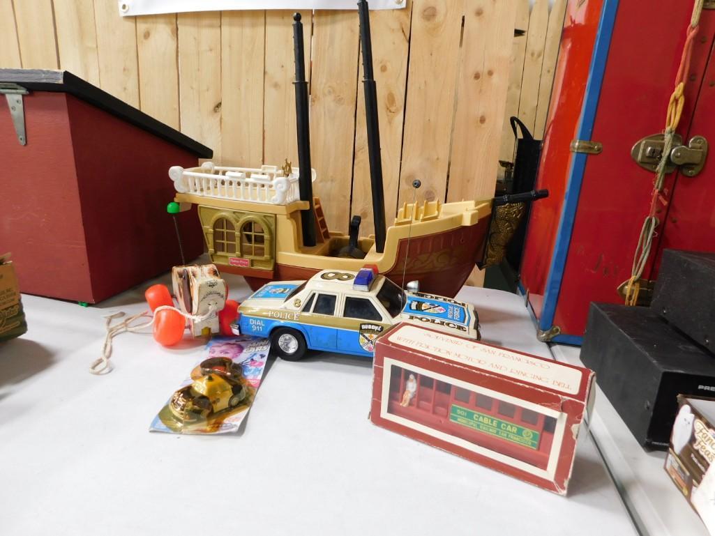 Misc Toy Lot including Fisher Price Pull Dog, Police Car: Misc Toy Lot including Fisher Price Pull Dog, Buddy L Police Car (no remote), Pirate Ship, etc.