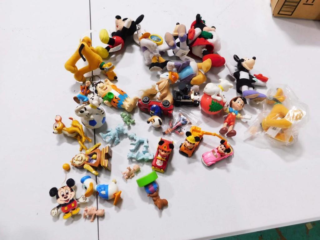 Toy Lot incl Disney , Flintstones, Etc: Disney and more Lot incl Figurines, Toys, Etc . Includes a pull string Mickey Mouse, a wind up Donald Duck, 1980 Mickey Mouse Matchbox car, Flintstones, Jerry from Tom and Jerry , etc