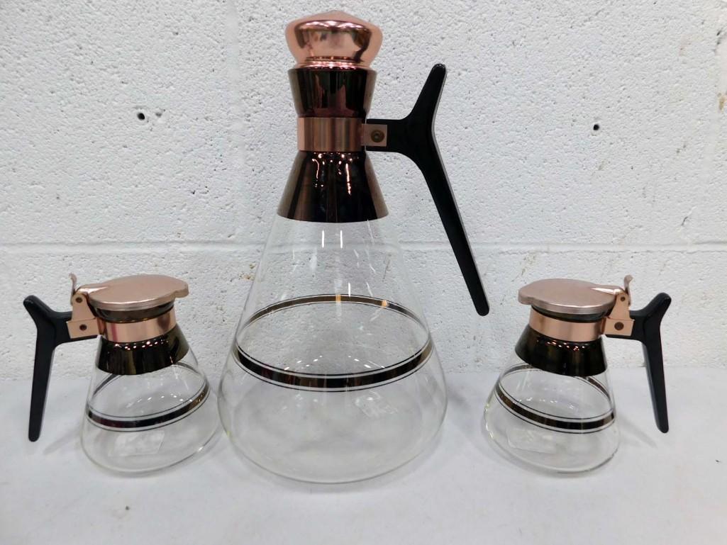 3 MCM Carafes Inland with Bakelite Handle: 3 MCM Carafes Inland with Bakelite Handle. Includes 1 large and 2 mini