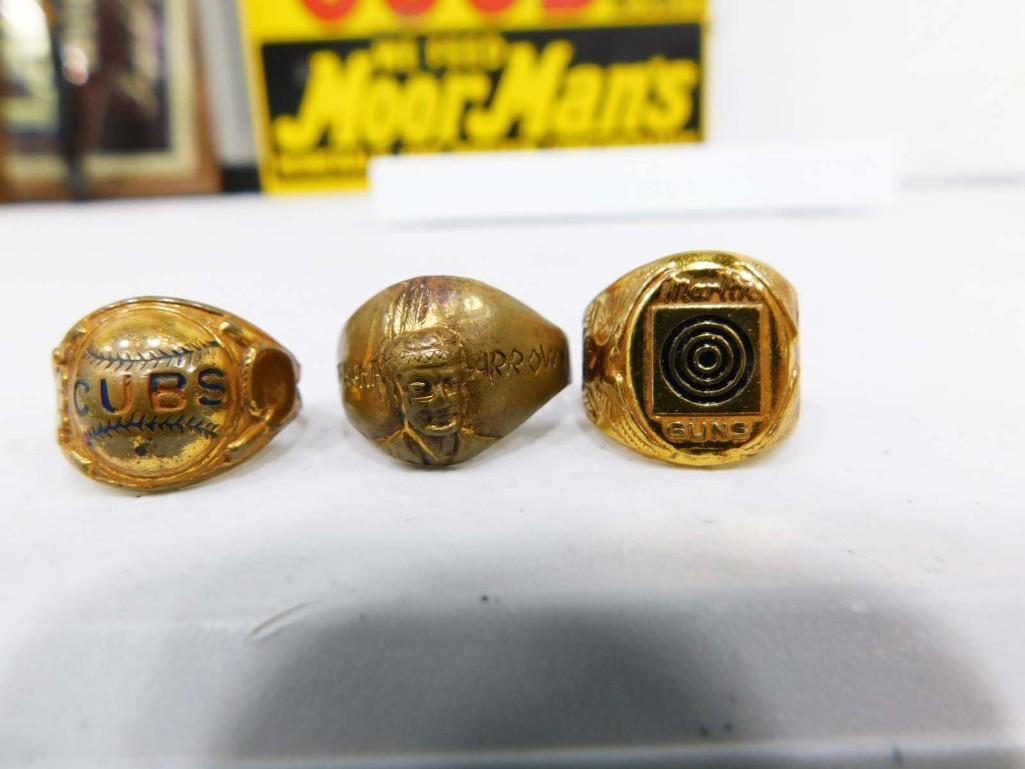 3 Vtg Brass Rings incl 1937 Marlins Firearms Bulls Eye Premium, Early 1900s: 3 Vtg Brass Rings incl 1937 Marlins Firearms Bulls Eye Premium, Early 1900s Chicago Cubs, and 1949 Straight Arrow Bandana Brass Adjustable Rings. Marlins ring promoted a Tom Mix Special .22 Caliber ri