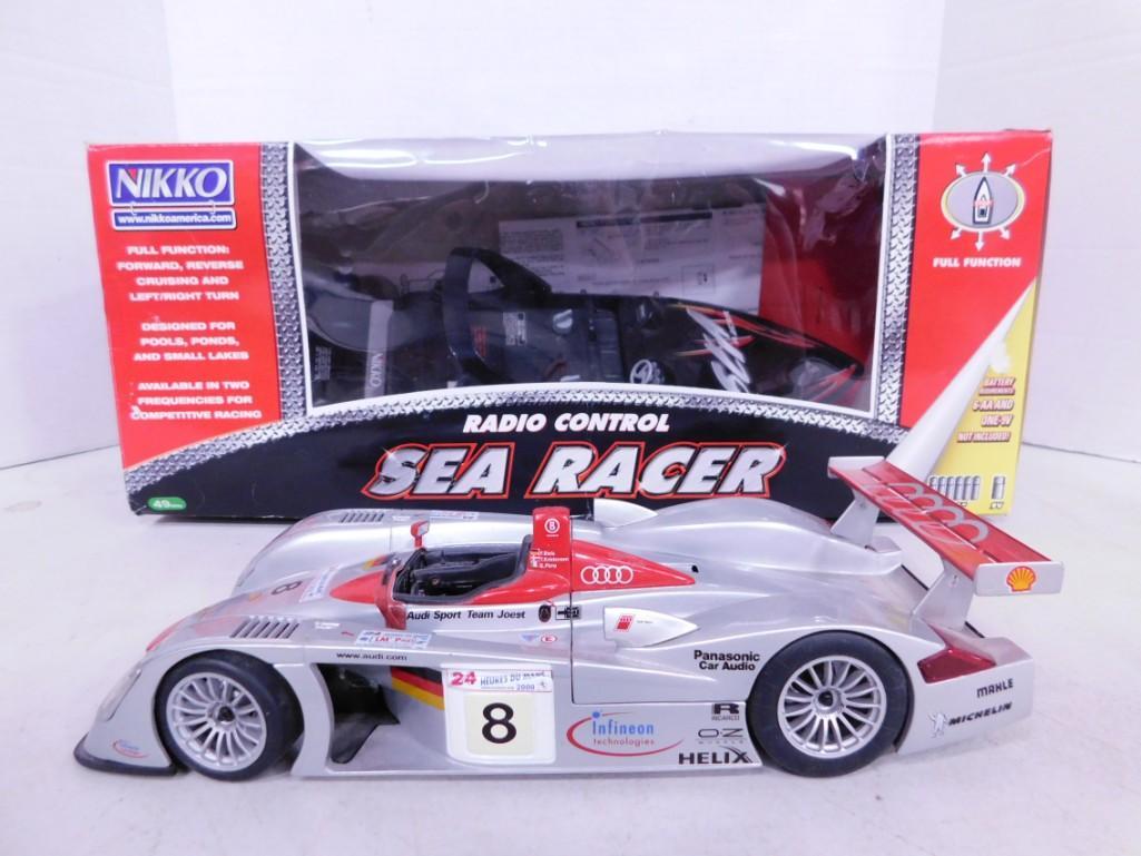 2 RC Vehicles incl New Radio Control Sea Racer and Le Mans 2002, Infineon Audi R8 Race Car #1, Silve: 2 RC Vehicles including 1/18 Scale Die Cast Model Le Mans 2002 Infineon Audi R8 Race Car #1 Silver Maisto GT Racing Toy Car and New in Box Nikko Radio Control Sea Racer . Condition: includes everythin