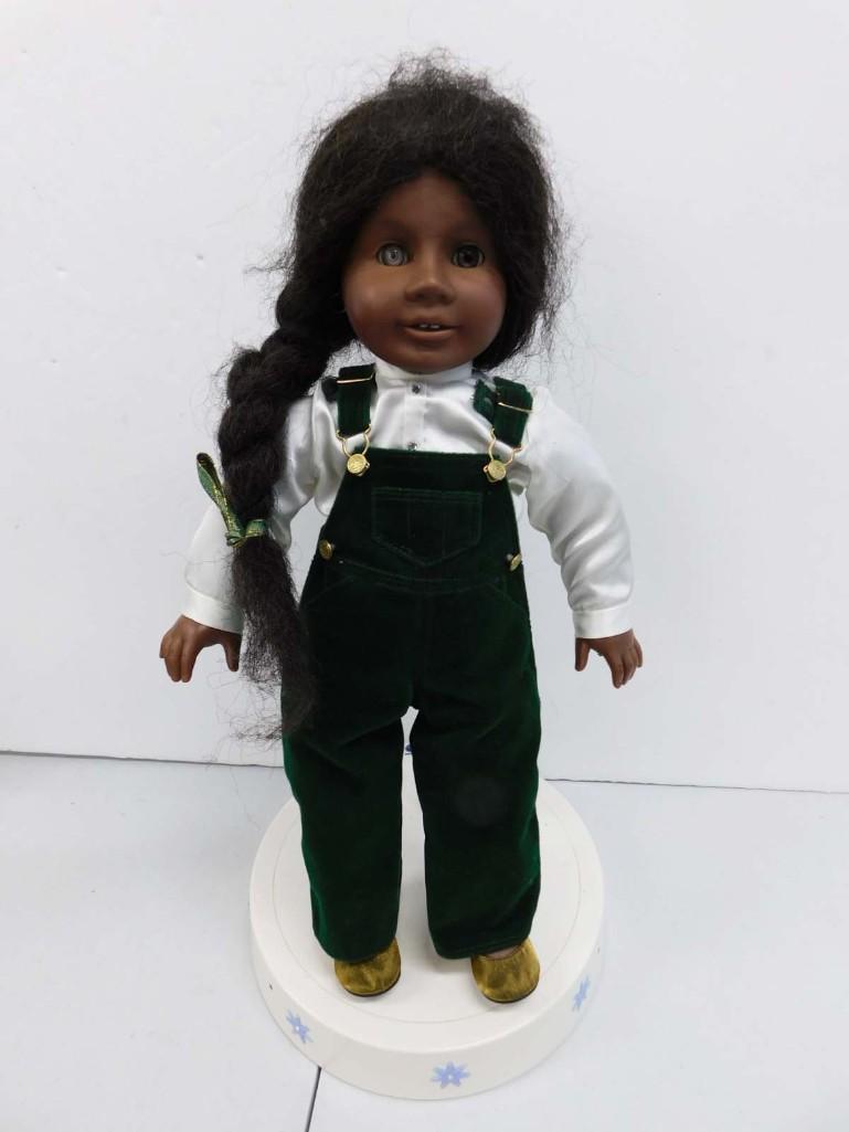 American Girl Addy Doll with Holiday Bibs Outfit and Talking Stand: American Girl Addy Doll with Holiday Bibs Outfit and Talking Stand. Condition: one of her eyes is silver. Stand is untested.