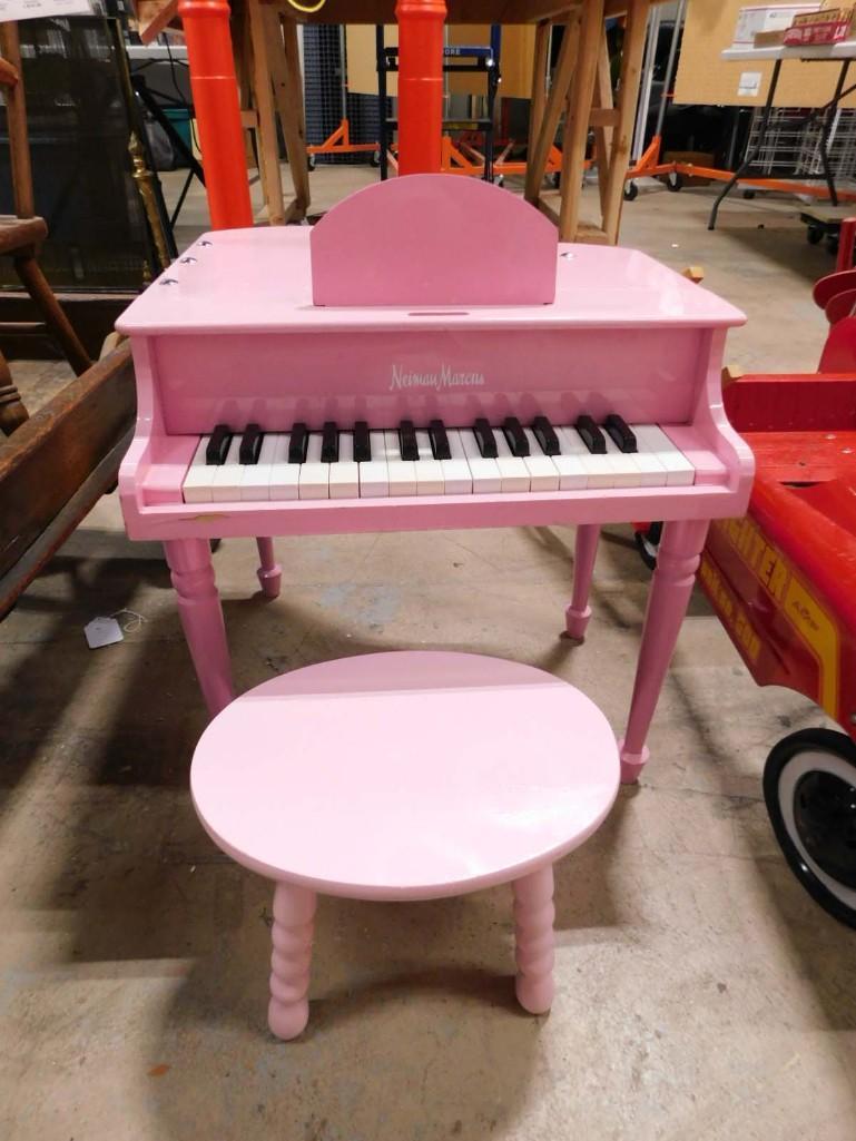 Limited Edition Neiman Marcus Pink Grand Piano Toy with Bench: Limited Edition Neiman Marcus Pink Grand Piano Toy with Bench . Nice kids sized version. Top opens like a baby grand piano. Plays well. Nice played with condition. The original stool was damaged. This