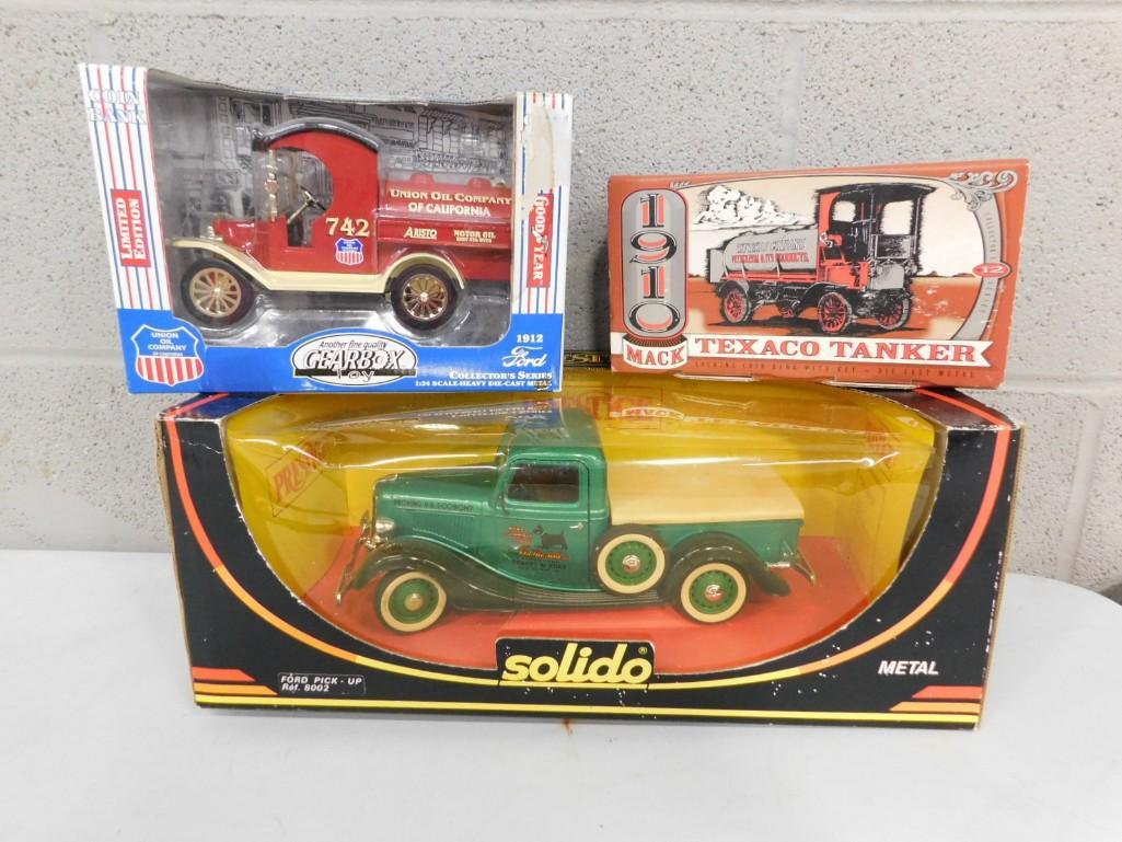 Lot of 3 TOy Trucks / Tanker including Ford and Mack: Lot of 3 TOy Trucks / Tanker including Ford and Mack Union Oil 1912 Ford from Gearbox, 1910 Mack Texaco Tanker, Solido Metal Ford Pick-Up 8002 with boxes