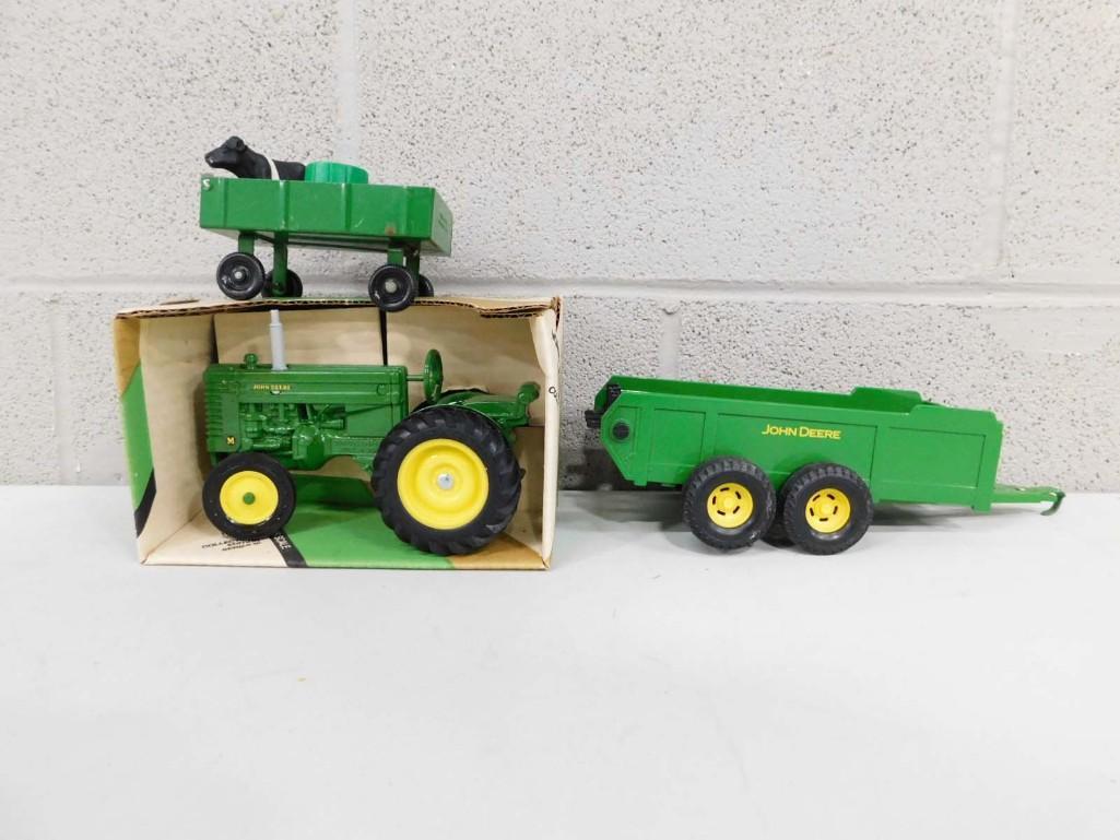 Farm Toy Lot incl Ertl John Deere Die Cast Model M Tractor 1/18 Scale, John Deere Pressed Steel Manu: Farm Toy Lot incl Ertl John Deere Die Cast Model M Collector's Edition Series III Tractor 1/16 Scale New Old Stock, John Deere Pressed Steel Manure Spreader, Green Pressed Steel Farm Wagon Toy, an