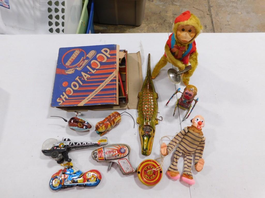 Lot of Vintage Toys including Metal Wind-up, Shoot-A-Loop, Monkey with Cymbal,: Lot of Vintage Toys including Metal Wind-up, Shoot-A-Loop, Monkey with Cymbal, sparking Gun, etc. These are fairly large - the alligator is about 15" long