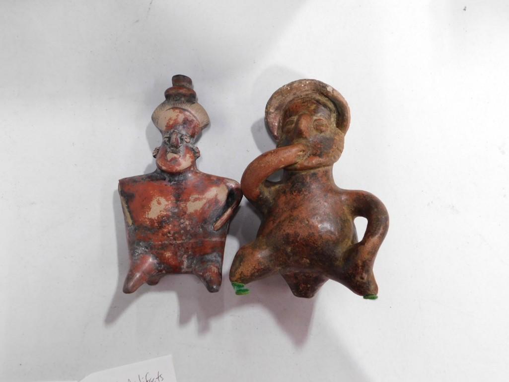 2 Pre Columbian Terra Cotta Figurines: 2 Pre-Columbian Terra Cotta Figurines including a man kneeling and smoking nayarit and a Woman with Basket or Headpiece on Head. Condition: both have some scuffing/paint wear, man has a chip on his ha