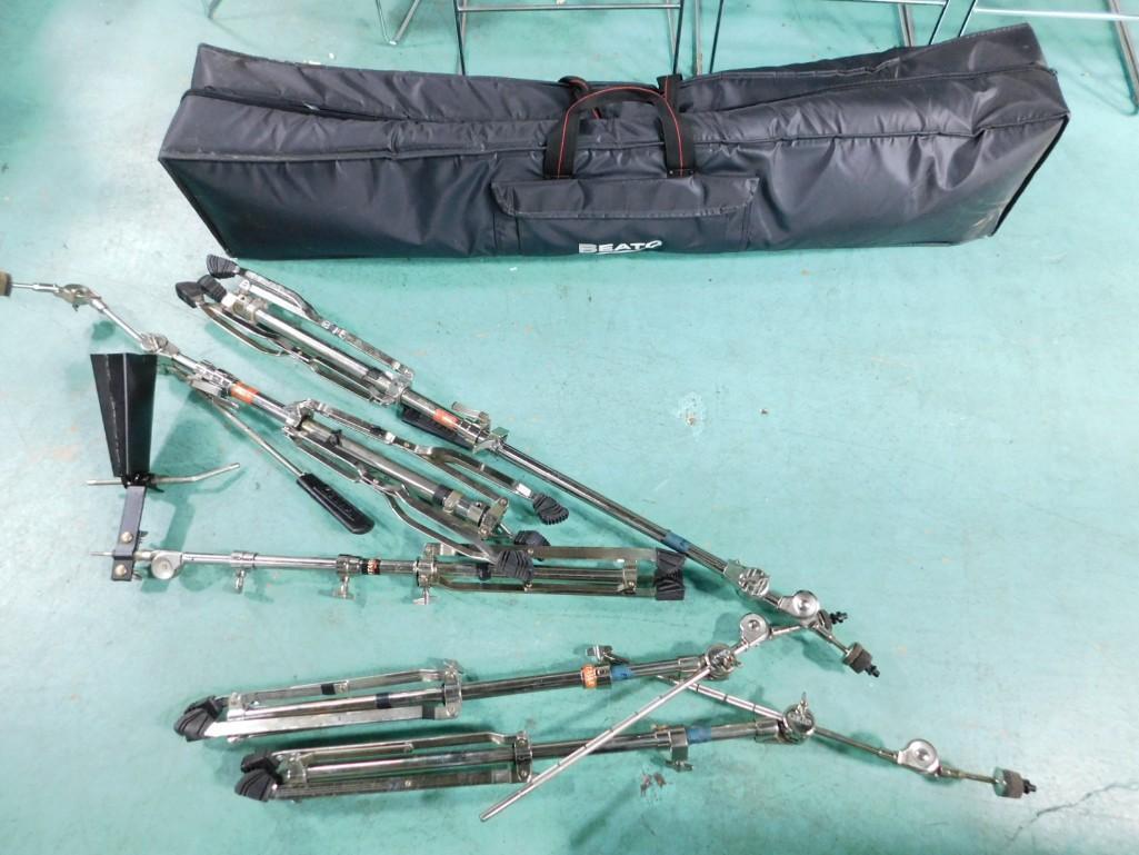 Percussion Bag with Cowbell with Stand and 4 Various Drum Stands: Percussion Bag with Cowbell with Stand and 4 Various Drum Stands Condition: This was used by a band that played in bars back in the day and the case smells smokey