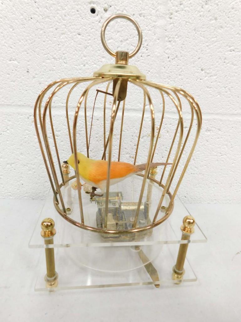 Birdcage Music Box with moving bird: Birdcage Music Box with moving bird - plays 'Somewhere my Love' / Laura's Theme from Dr. Zhivago. When playing, the bird swings. It works.