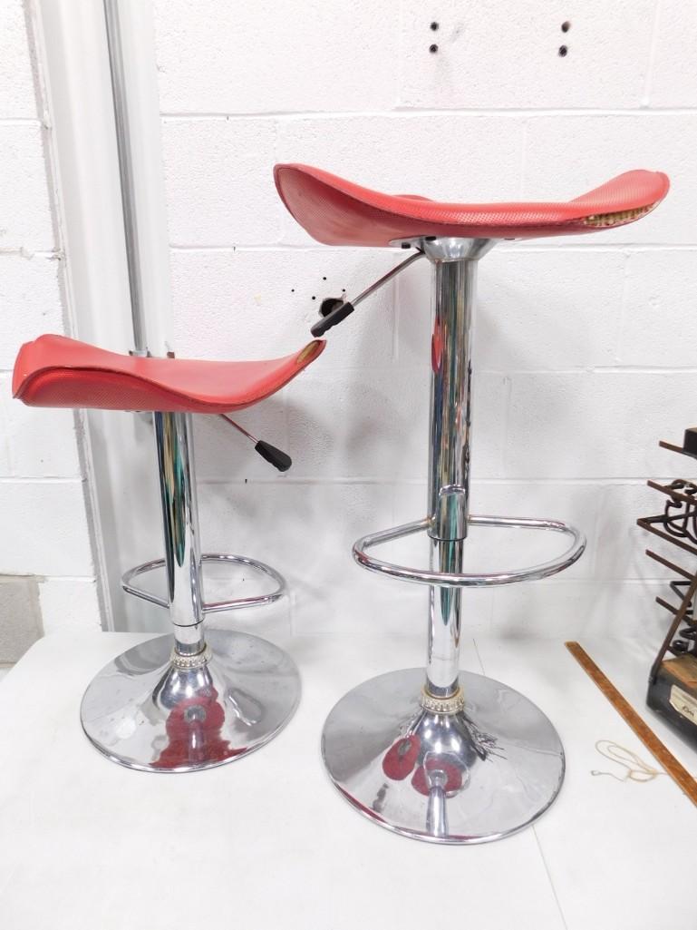 2 Vintage Barstools with Chrome Bases and Red Seats: Pr of Vintage Bar Stools with Chrome Bases and Red Seats . Vintage. Adjustable. approx 24" tall when completely down and 34" when completely up. Condition: seats have tears