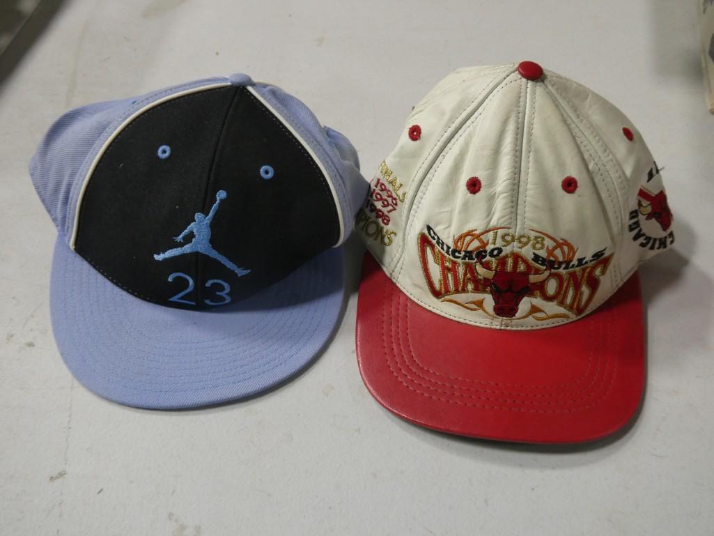 Pair of Chicago Bulls hats: Pair of Chicago Bulls hats including Leather brim 1998 Champion and Michael Jordan 23 with tag