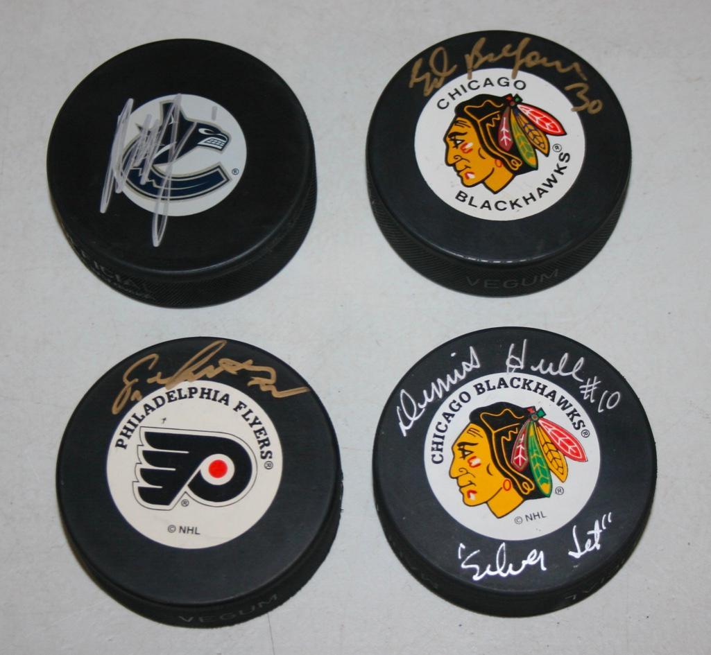 4 Signed Pucks - D. Hull, Belfour, Lindros, and Luongo: 4 Signed Pucks - D. Hull, Belfour, Lindros, and Luongo COA's for Lindros and Luongo only.