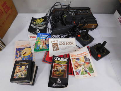 Atari VCS / 2600 Video Game System with Paddles, Controllers, games, etc.: Atari VCS / 2600 Video Game System with Paddles, Controllers, games, etc. Appears to have all the cords, manual, Donkey Kong, Missile Command, Pac-Man, etc. Untested. This is the early one (VCS) becau