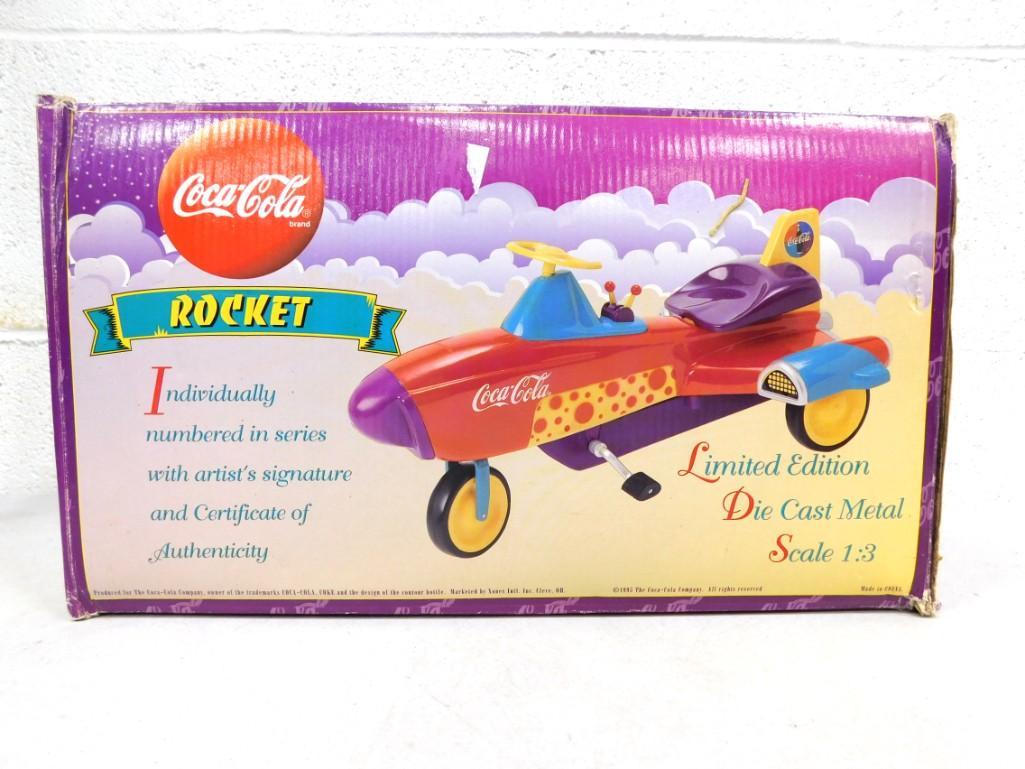 Coca Cola Limited Edition Die Cast Metal Pedal Rocket Signed Ken Kovach NO COA: Coca Cola Limited Edition Die Cast Metal Pedal Rocket Signed Ken Kovach - No COA for the signature, but has a COA saying it's a limited edition . No 4127 of 20,000 . Pedal is detached on one side