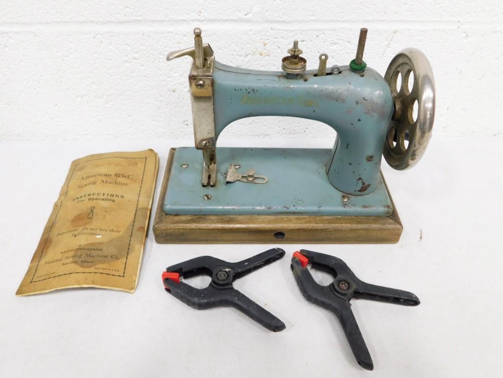 Vintage American Girl Sewing Machine by National Sewing Machine Co with Original Instructions: Vintage American Girl Sewing Machine by National Sewing Machine Co with Original Instructions . Seems to be a hand crank model. Blue Gray Color. Condition: untested