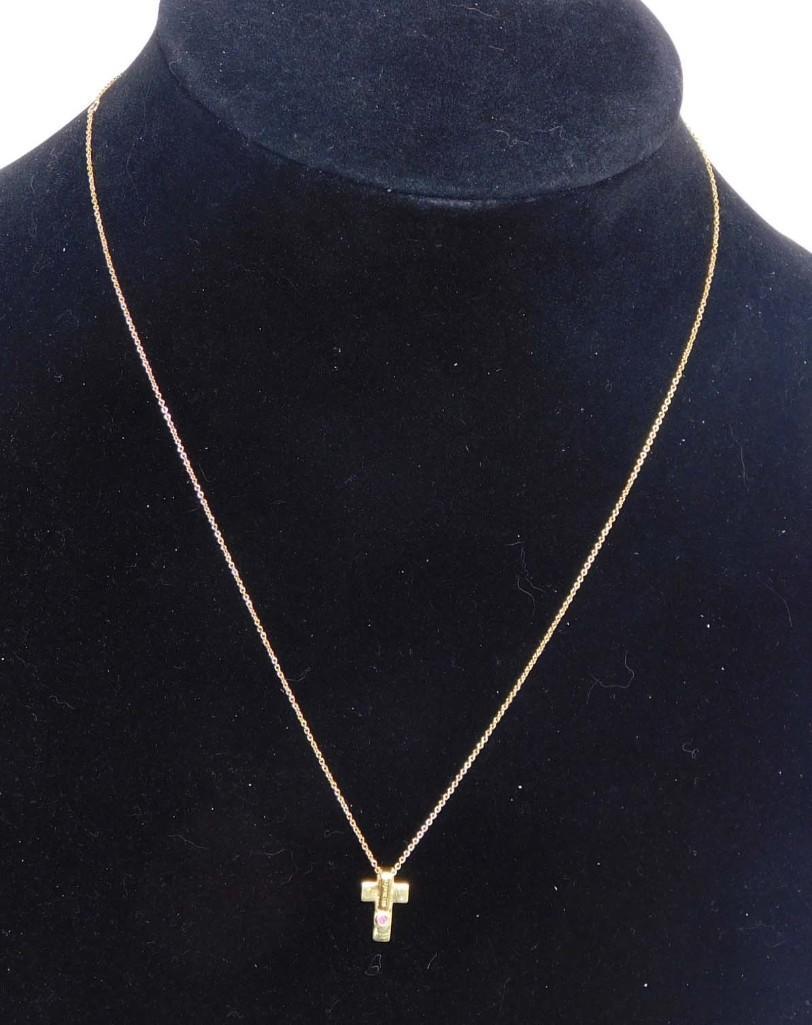 18K Cross and Chain with Small Ruby Stone: 18K Cross and Chain with Small Ruby Stone - 3.04g Total - PLEASE NOTE: any props, stands, displays, trays, and/or quarters shown in the pictures are not included with the item(s) and are shown for dis