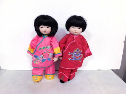 2 Asian 16" Porcelain Boy and Girl Dolls P.B.J. Lot: Approximately 16&#34; tall, black hair, brown glass eyes, bisque porcelain and cloth. A/O. Marked P.G.J. CHGM (girl), and P.B.J. CBHL (boy). Clean, vgc, no boxes. Includes items shown.