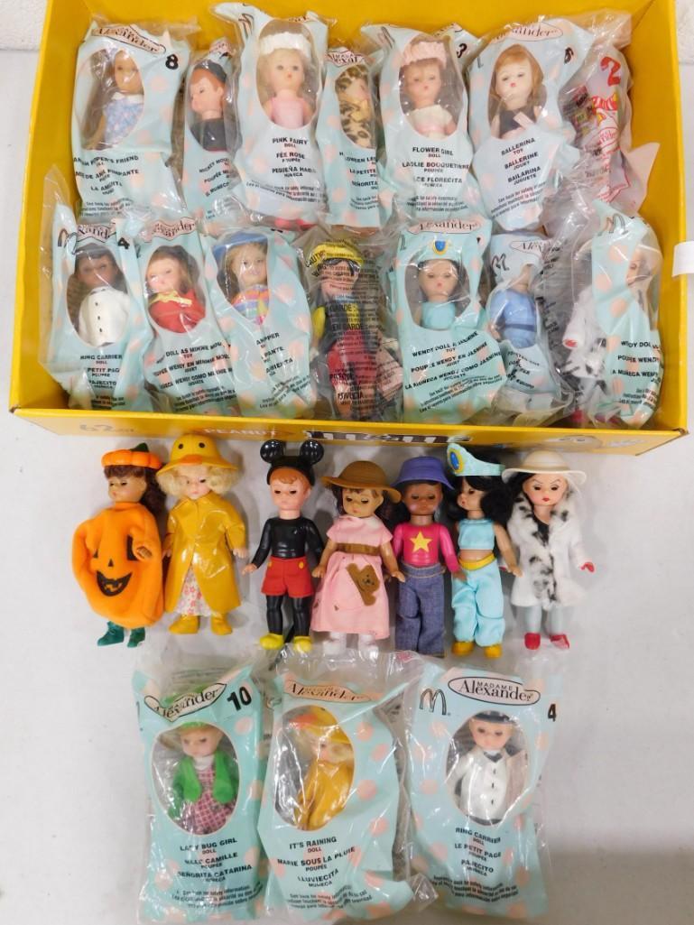 24 McDonalds Madame Alexander Dolls Lot: Includes 24 dolls. Dolls are approx 5" tall, posable, with sleep eyes. Clean, most are new in package
